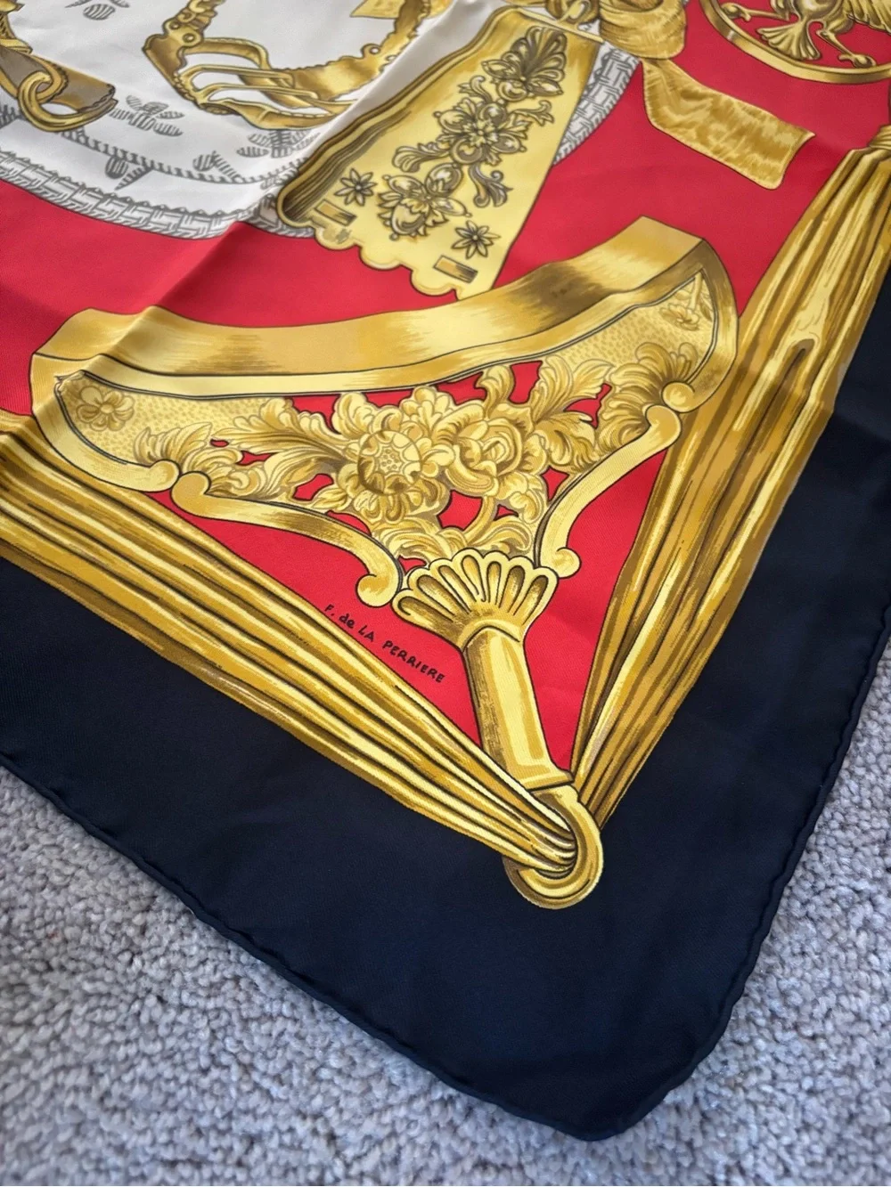 Hermès silk scarf in gold, red and black ornate print